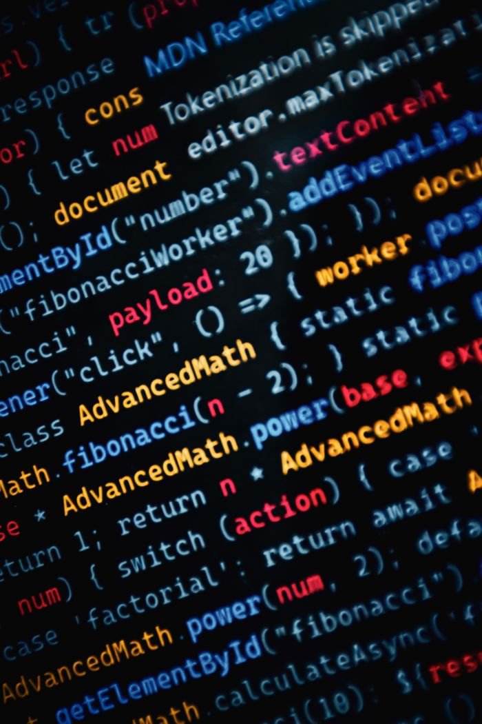 digital-01 Close-up of vibrant JavaScript code displayed on a monitor showcasing web development.