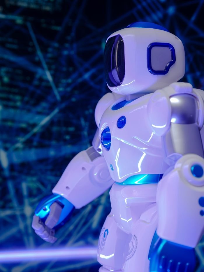 mobile-02 Close-up of a modern humanoid robot with glowing blue lights and futuristic design.